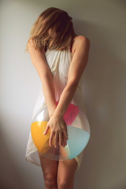 woman holding beach ball