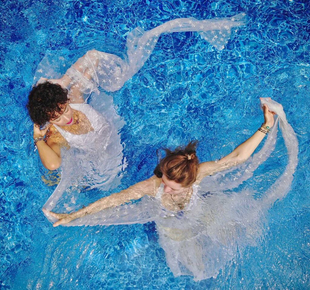 aerial view photography of two women on water during daytime