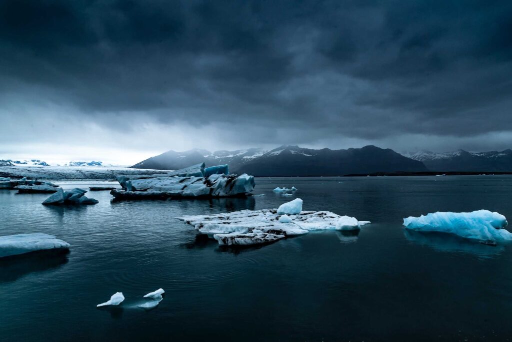 glacier near body of water