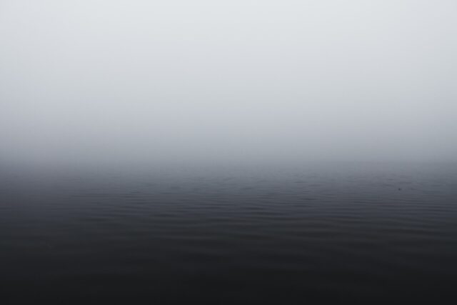 grayscale photography of body of water