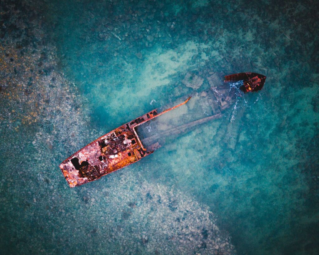 aerial view of brown ship on body of water