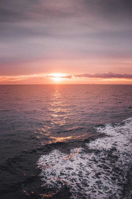 body of water during sunset