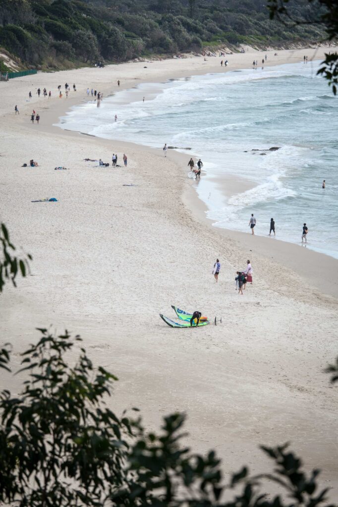 crowd of people on beach at daytime