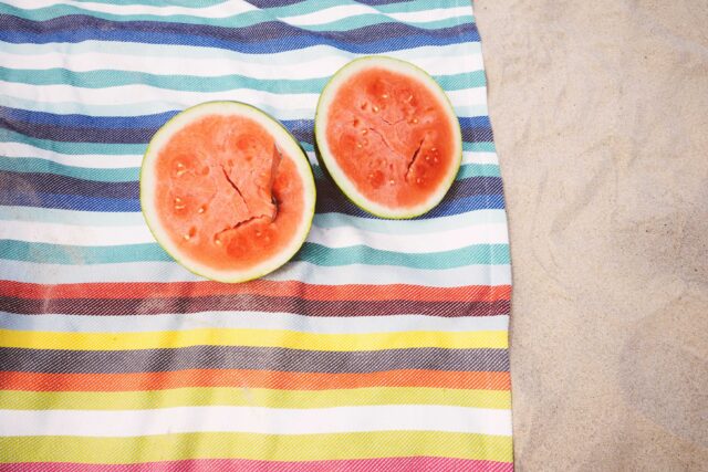 closeup photo of slice watermelon fruits on cloth