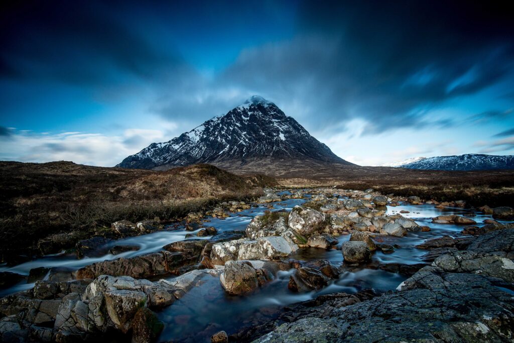 body of water at the foot of mountain